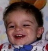 A younger mikey smiles for a picture